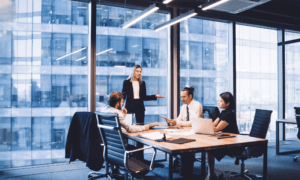 A group of people sitting in a conference room.