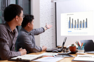 Small and Medium Enterprise Business concept of ,Businessman presenting investment plan to his partner in office.