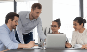 People looking at a computer.