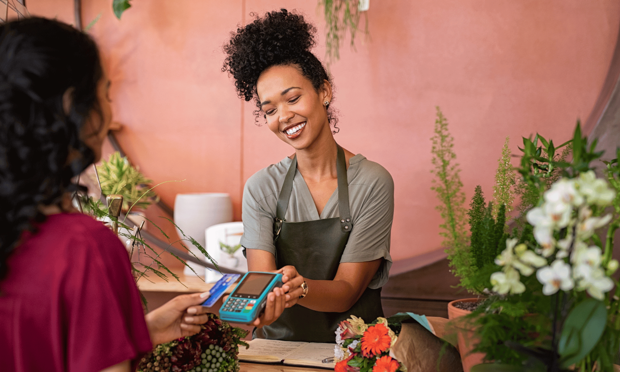 Someone using a credit card to purchase something.