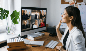 A person looking at a computer screen in a remote meeting