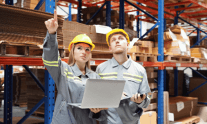 Two people working in a warehouse.