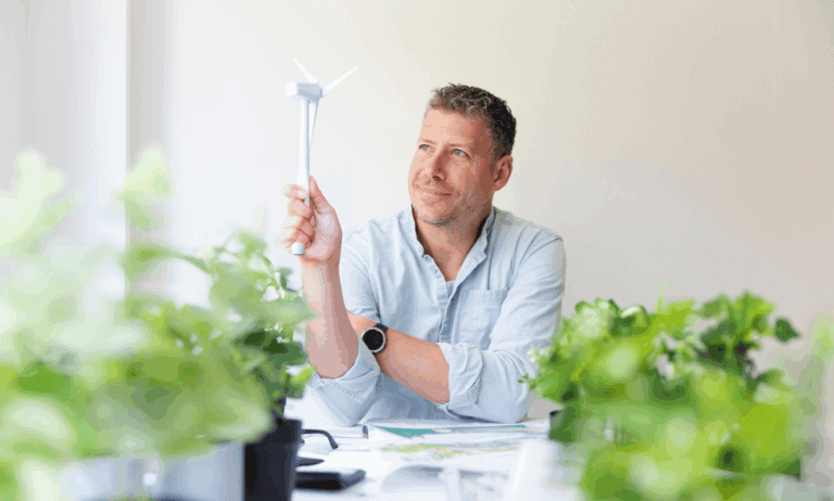 Someone holing a small wind mill.