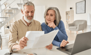 Two people looking at papers