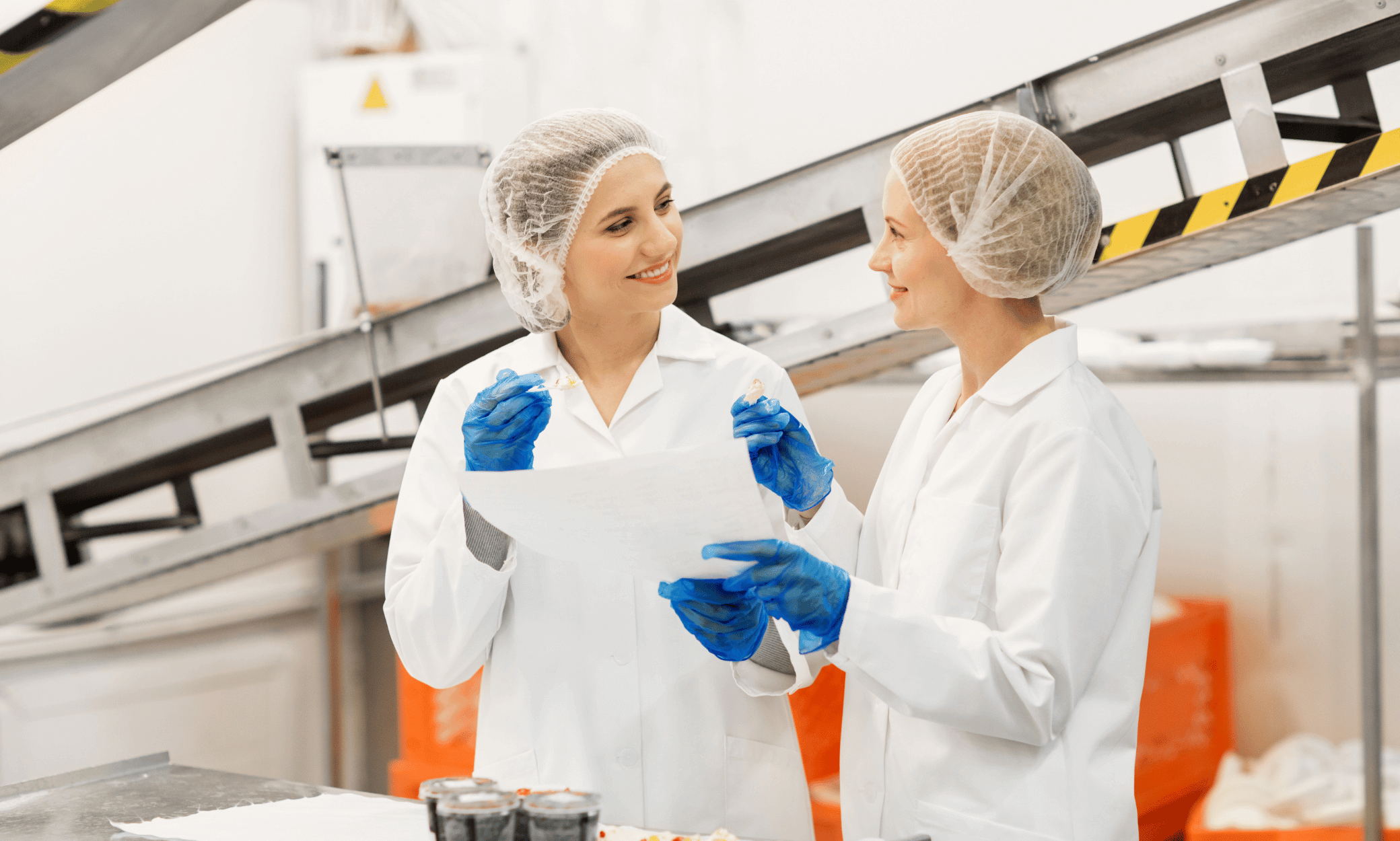 Two people testing out food in a lab.