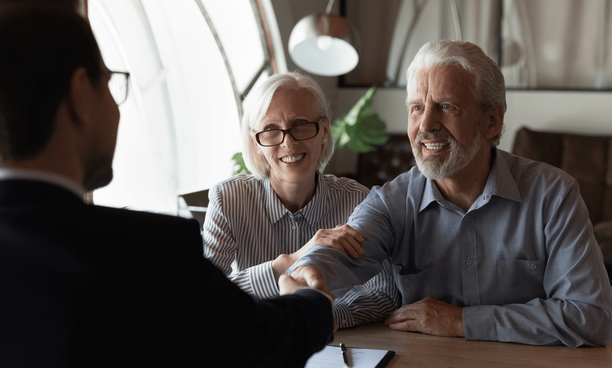 Two people shaking hands.