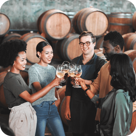 People cheering wine glasses.