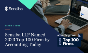 A person typing on a computer and the accounting today top 100 firms logo.