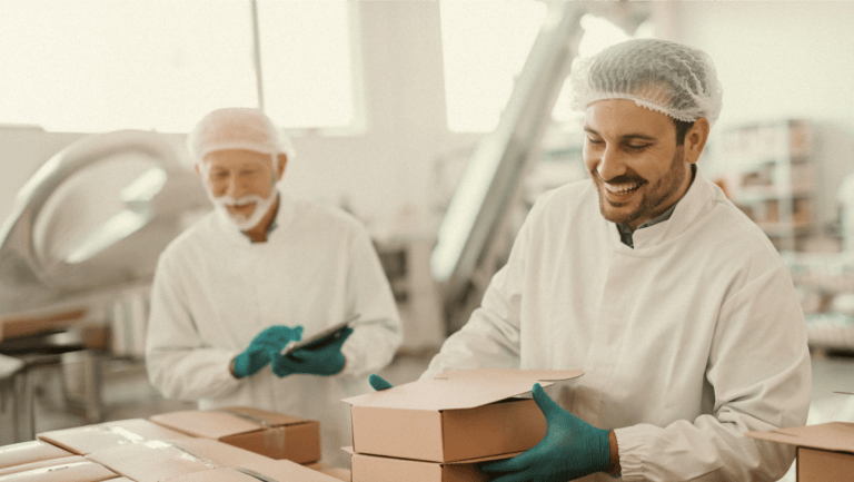 Two people packing boxes