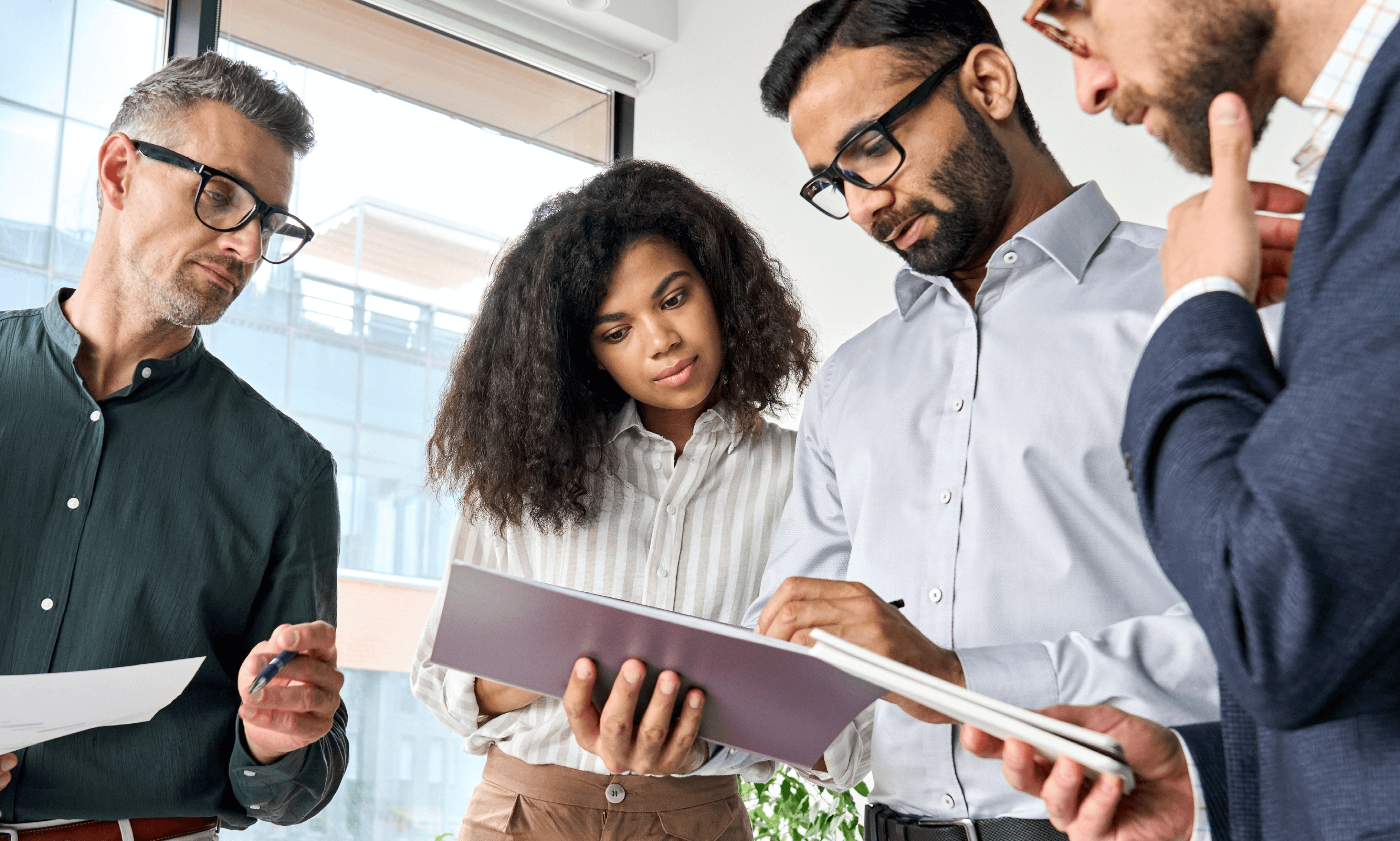 A group of people reviewing documents.