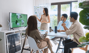 Group of workers in a sustainability presentation meeting.