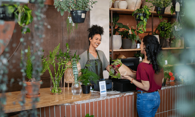 Small business worker assisting a customer.