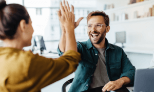 Two team members high-fiving