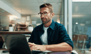 Someone looking at a laptop