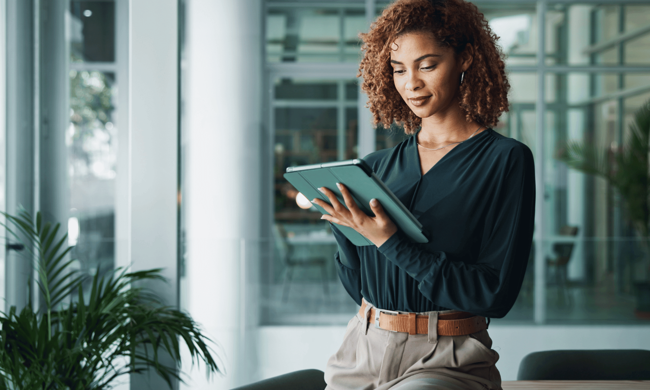 Someone holding a tablet.