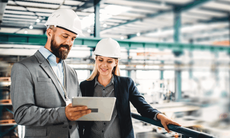 Two people looking at a tablet