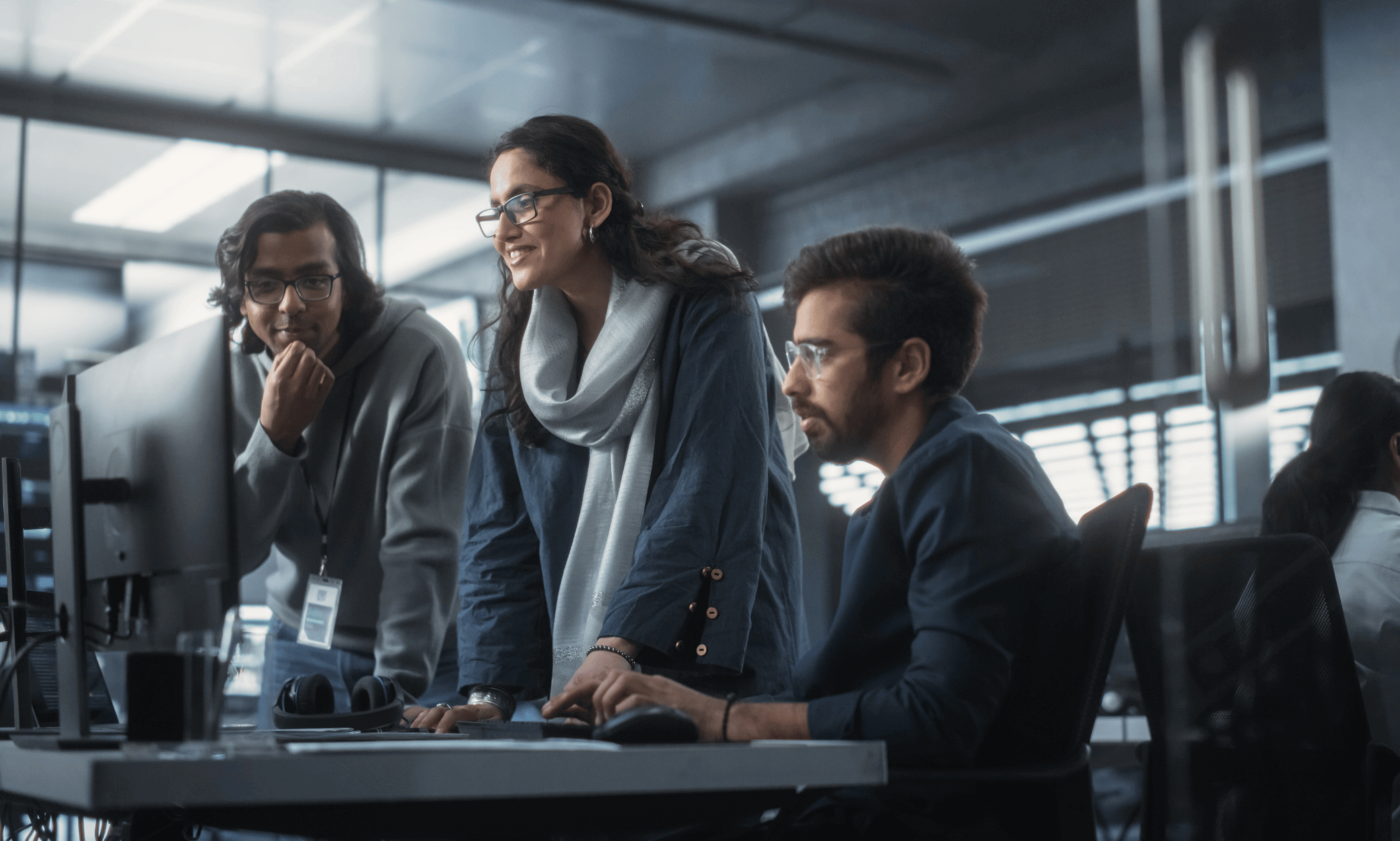 People looking at a computer