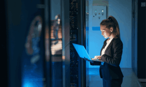 Someone holding a laptop.