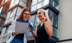 Two people looking at papers.