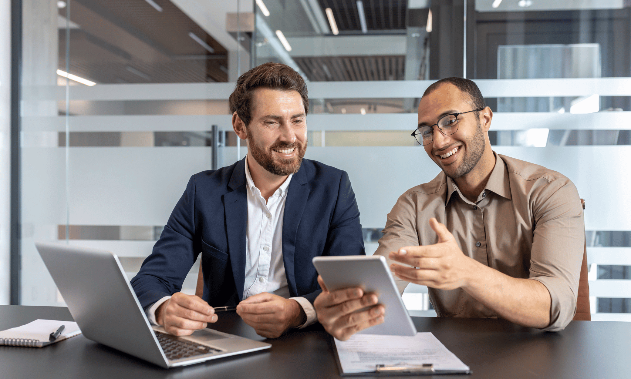 Two people sitting at a desk