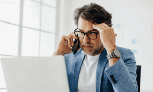 Someone looking at a laptop