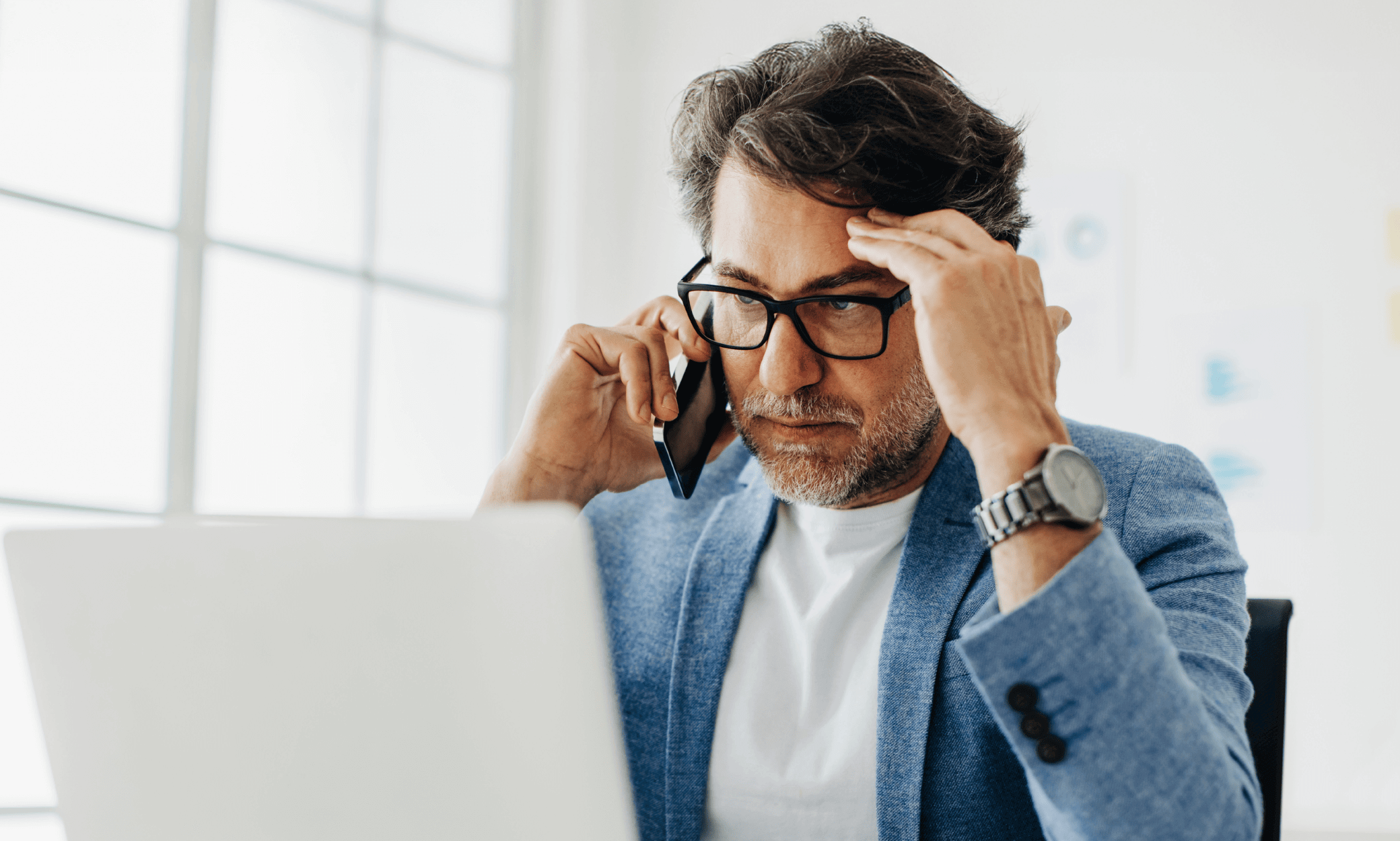 Someone looking at a laptop