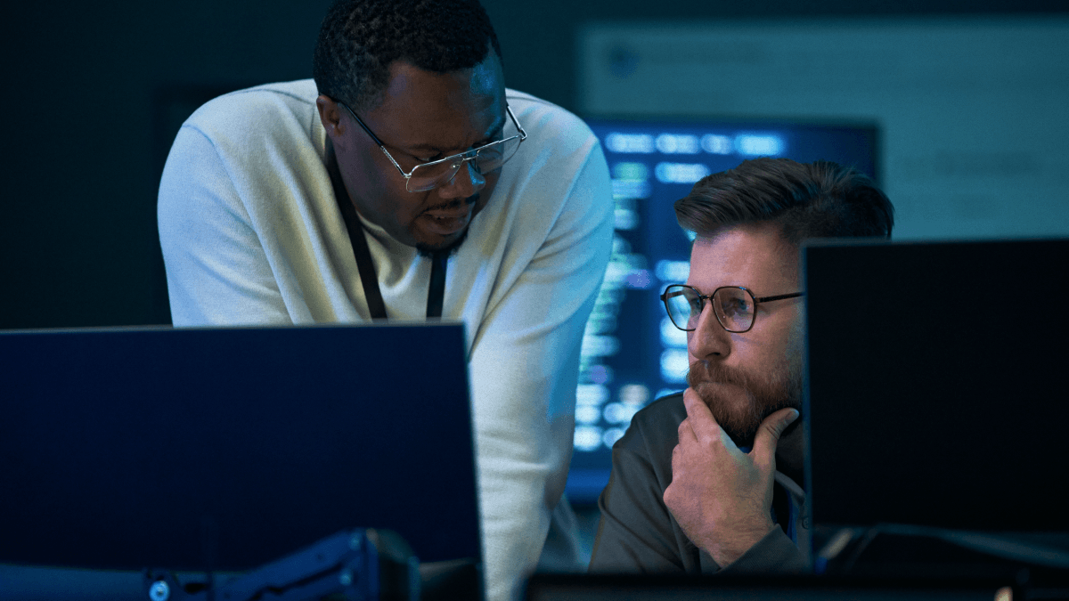Two people looking at a computer