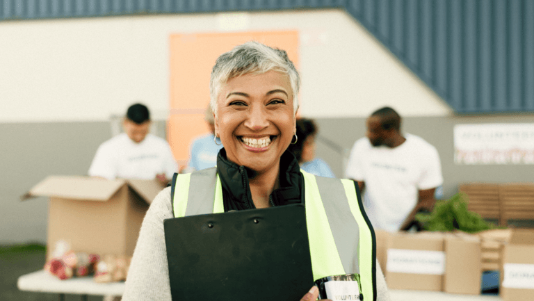 A volunteer holding a clipboard