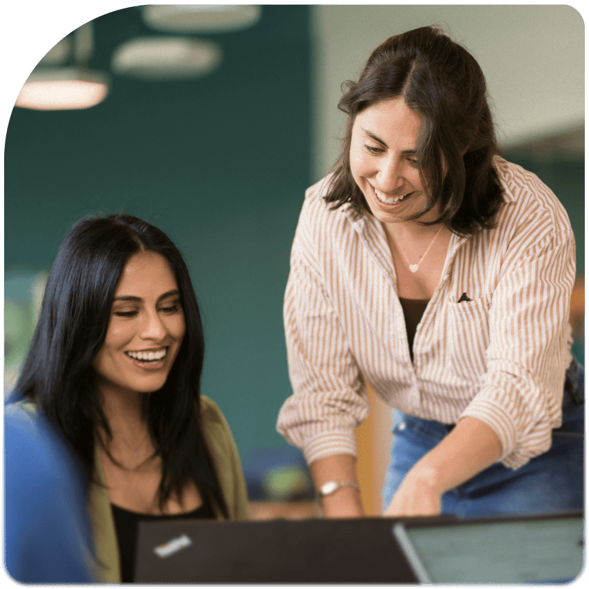 Two Sensiba employees looking at a computer
